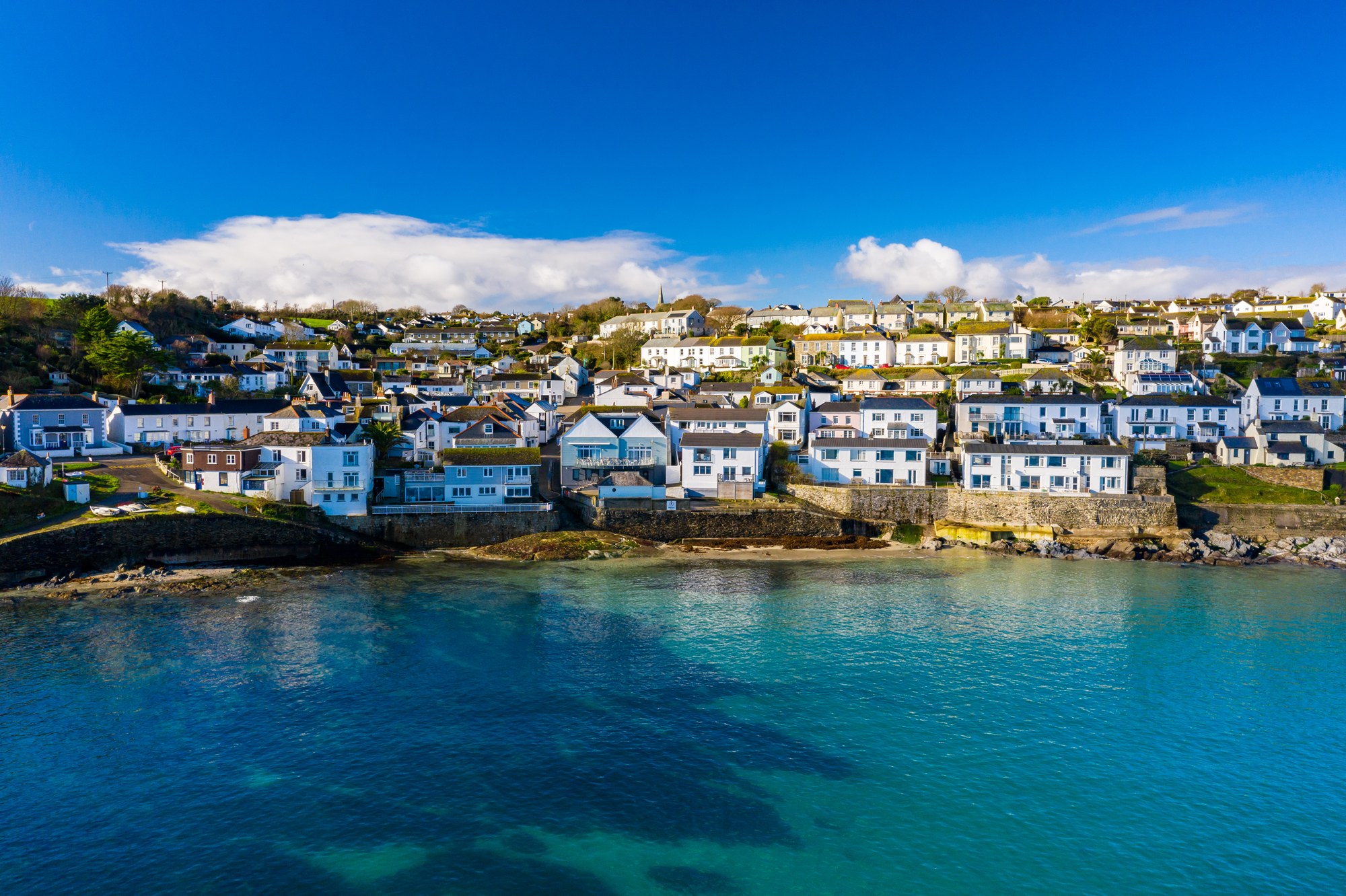 Top Deck on the waterfront, with Portscatho village and harbour behind it